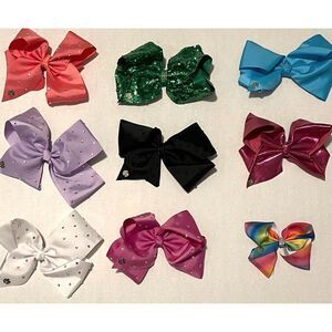 JoJo Siwa 7” Bows and 1 5” Bow.  In like new condition.  Alligator clips.
